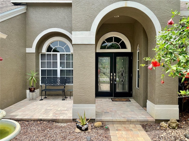 4808 Jewell Ter, Palm Harbor, FL 34685 - entrance to property featuring stucco siding and french doors