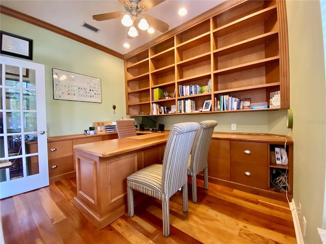 4808 Jewell Ter, Palm Harbor, FL 34685 - office featuring built in study area, ornamental molding, light wood finished floors, a ceiling fan, and built in features