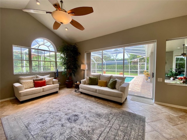 4808 Jewell Ter, Palm Harbor, FL 34685 - living room with ceiling fan, a sunroom, baseboards, and high vaulted ceiling