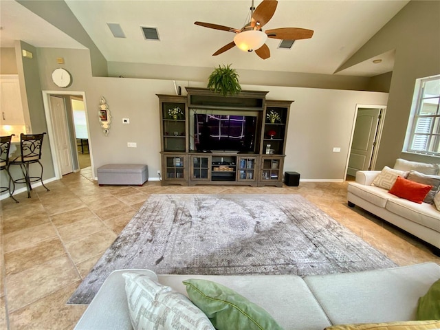 4808 Jewell Ter, Palm Harbor, FL 34685 - living room featuring lofted ceiling, a ceiling fan, and baseboards