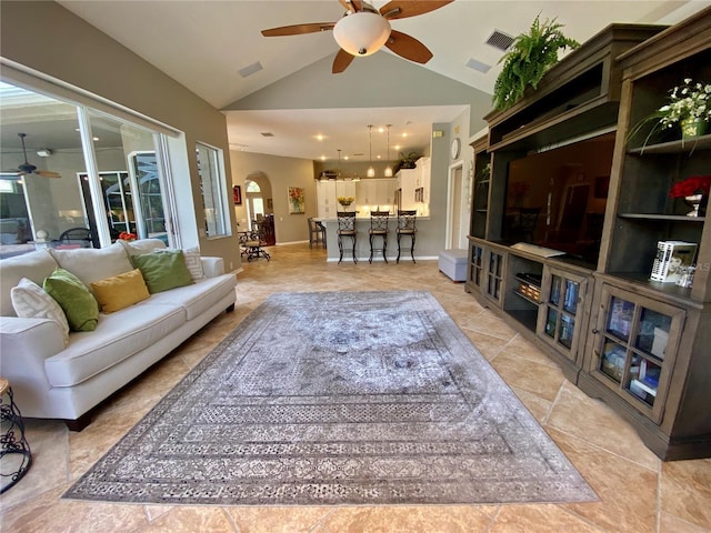 4808 Jewell Ter, Palm Harbor, FL 34685 - living area featuring a ceiling fan, arched walkways, and high vaulted ceiling