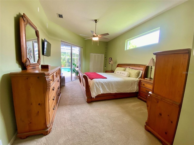 4808 Jewell Ter, Palm Harbor, FL 34685 - bedroom featuring access to exterior, light colored carpet, and ceiling fan