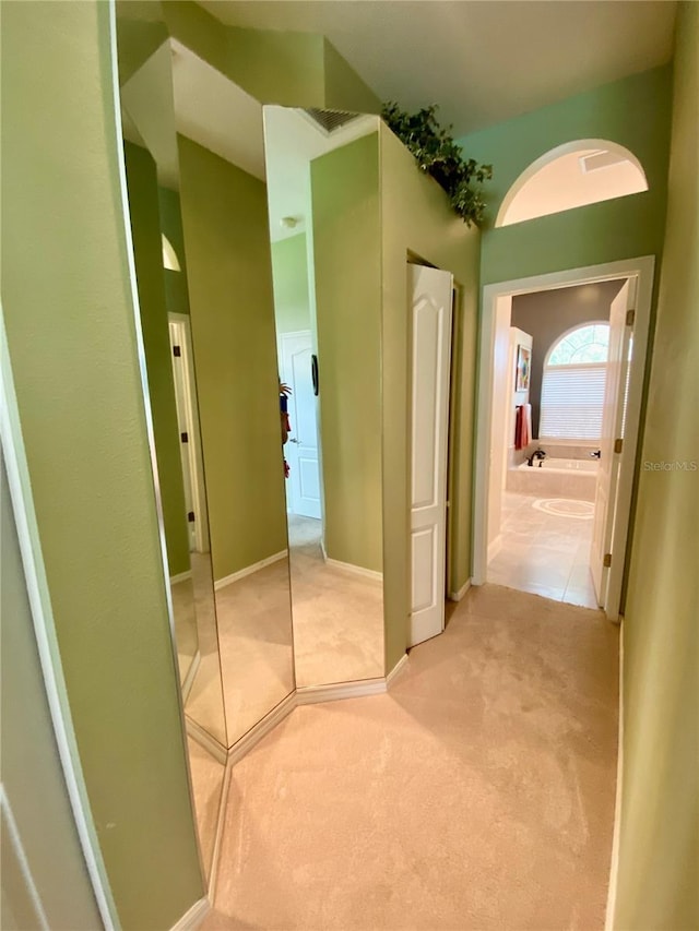 4808 Jewell Ter, Palm Harbor, FL 34685 - corridor featuring light colored carpet and baseboards