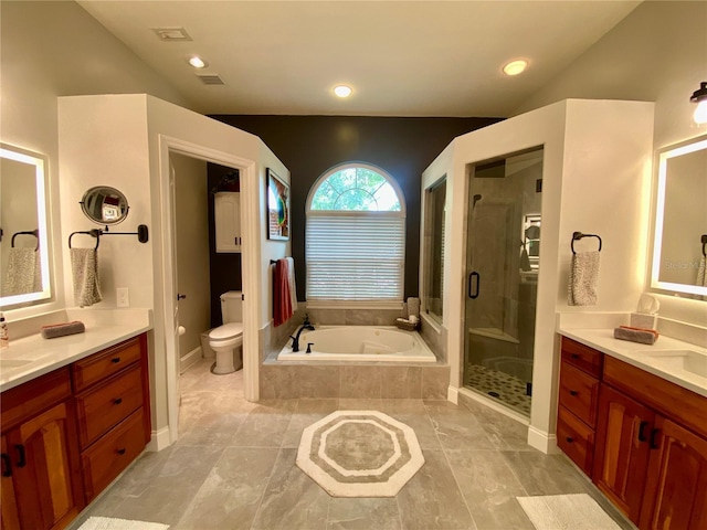 4808 Jewell Ter, Palm Harbor, FL 34685 - bathroom with two vanities, a shower stall, a garden tub, toilet, and vaulted ceiling