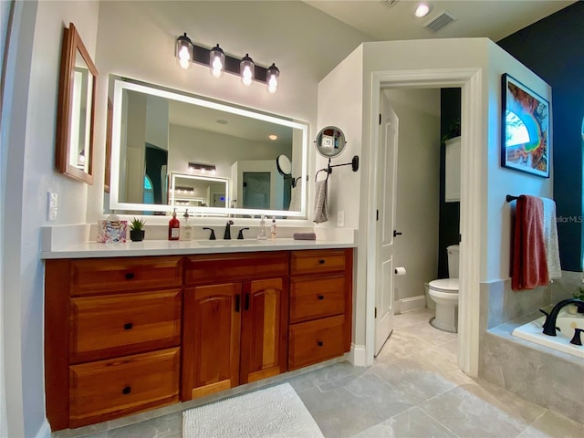 4808 Jewell Ter, Palm Harbor, FL 34685 - bathroom with toilet, a garden tub, vanity, and tile patterned floors