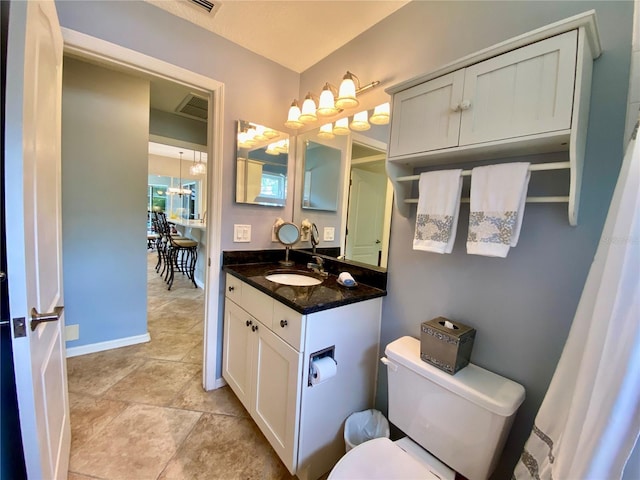 4808 Jewell Ter, Palm Harbor, FL 34685 - bathroom with vanity, toilet, and baseboards