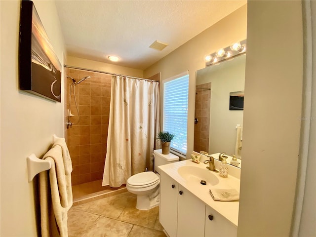 4808 Jewell Ter, Palm Harbor, FL 34685 - full bath with toilet, vanity, a tile shower, tile patterned floors, and a textured ceiling