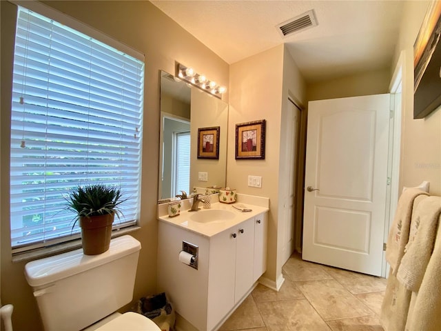 4808 Jewell Ter, Palm Harbor, FL 34685 - bathroom with toilet, vanity, and tile patterned floors