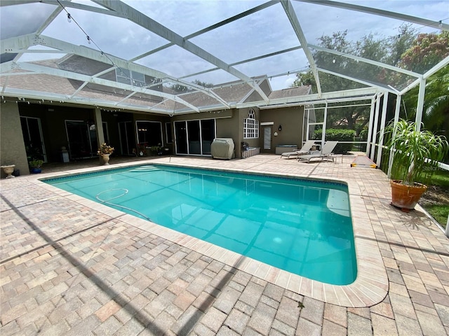 4808 Jewell Ter, Palm Harbor, FL 34685 - outdoor pool featuring a patio, a lanai, and area for grilling