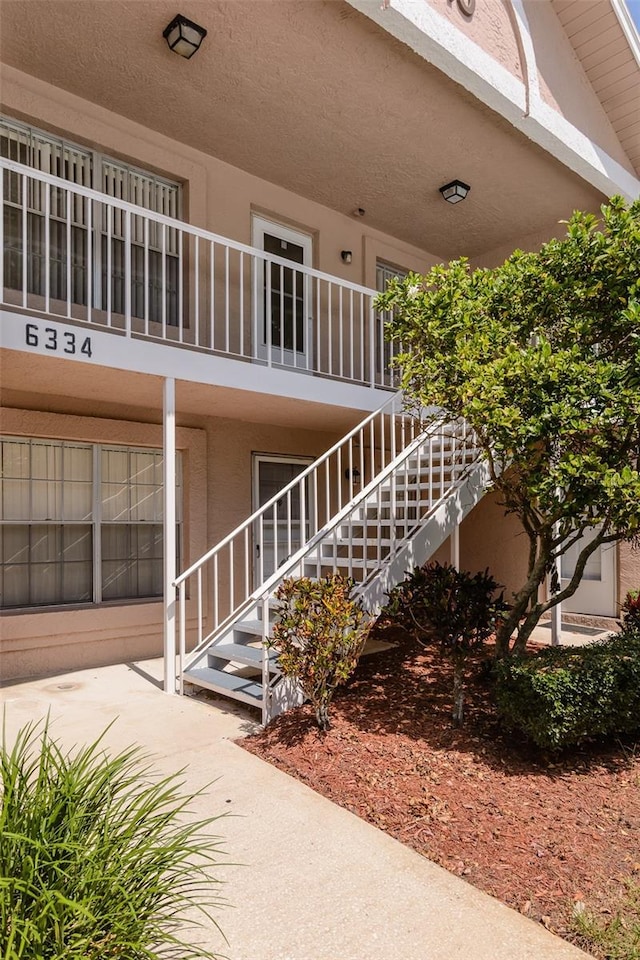 6334 Spring Flower Dr Unit 24, New Port Richey, FL 34653 - view of property featuring stairway