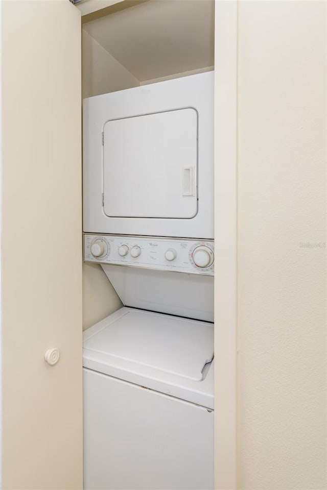 6334 Spring Flower Dr Unit 24, New Port Richey, FL 34653 - washroom with stacked washer / dryer