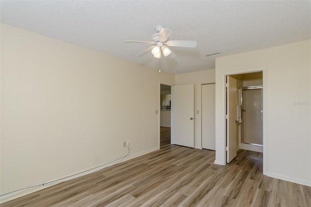 6334 Spring Flower Dr Unit 24, New Port Richey, FL 34653 - unfurnished bedroom featuring light wood-style floors, baseboards, a closet, and ceiling fan