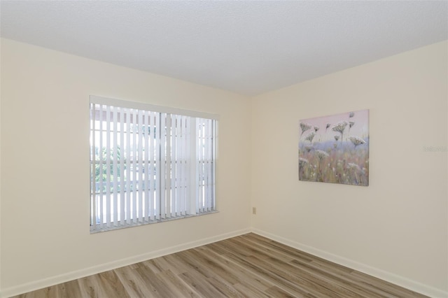 6334 Spring Flower Dr Unit 24, New Port Richey, FL 34653 - unfurnished room featuring wood finished floors and baseboards