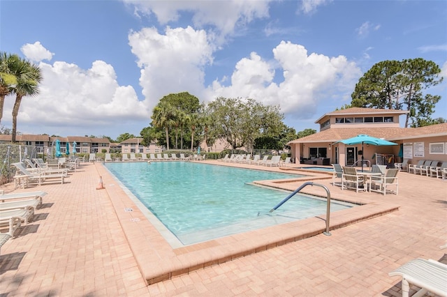 6334 Spring Flower Dr Unit 24, New Port Richey, FL 34653 - community pool with a patio area
