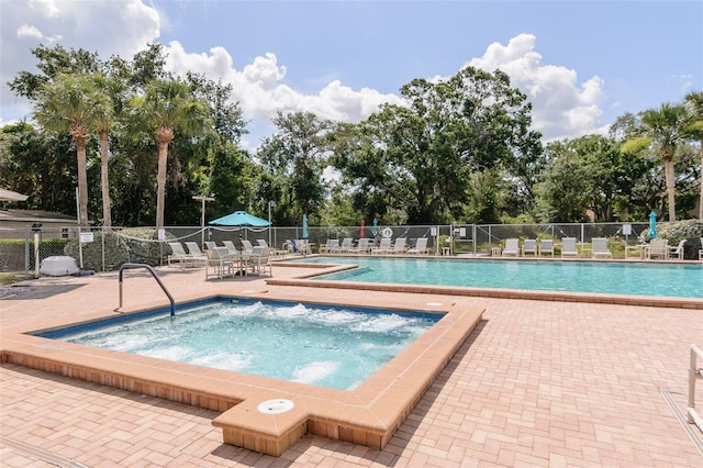 6334 Spring Flower Dr Unit 24, New Port Richey, FL 34653 - community pool with a hot tub, a patio area, and view of scattered trees