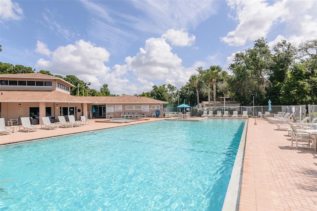 6334 Spring Flower Dr Unit 24, New Port Richey, FL 34653 - community pool with a patio area