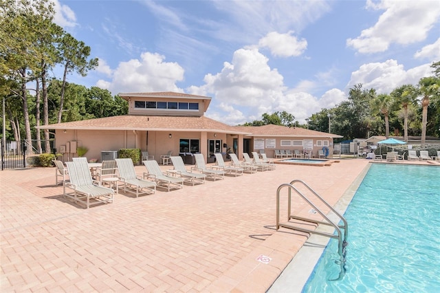6334 Spring Flower Dr Unit 24, New Port Richey, FL 34653 - community pool with a patio area and a community hot tub
