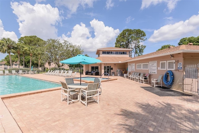 6334 Spring Flower Dr Unit 24, New Port Richey, FL 34653 - community pool with a patio area