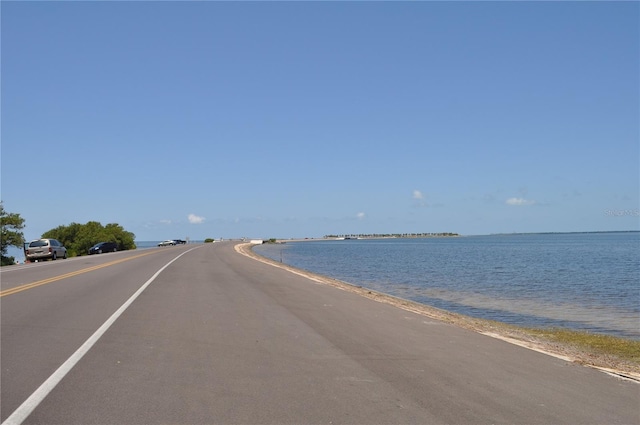 6334 Spring Flower Dr Unit 24, New Port Richey, FL 34653 - view of asphalt road with view of water and beach