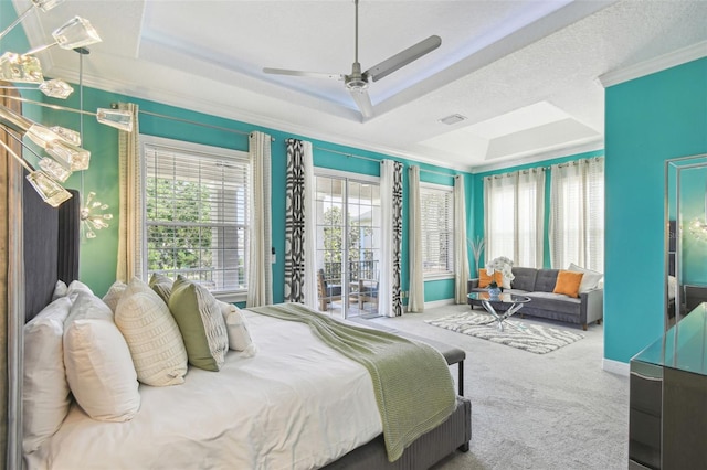 7523 Excitement Dr, Kissimmee, FL 34747 - bedroom with crown molding, a tray ceiling, carpet, a ceiling fan, and access to exterior