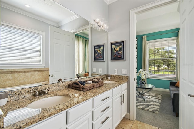 7523 Excitement Dr, Kissimmee, FL 34747 - full bathroom featuring double vanity, crown molding, and baseboards