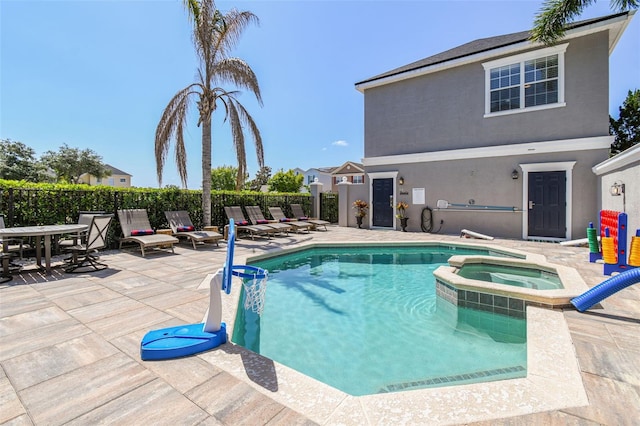 7523 Excitement Dr, Kissimmee, FL 34747 - view of swimming pool featuring a patio and a pool with connected hot tub