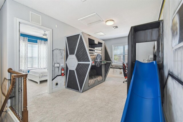 7523 Excitement Dr, Kissimmee, FL 34747 - bedroom with attic access and carpet