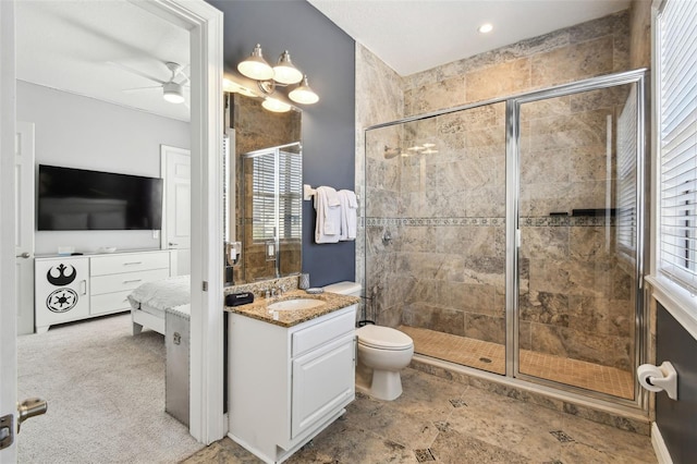 7523 Excitement Dr, Kissimmee, FL 34747 - ensuite bathroom with vanity, a shower stall, toilet, and a ceiling fan