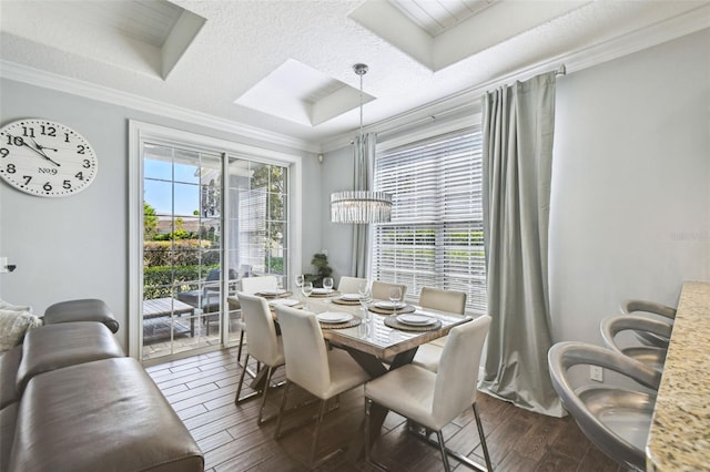 7523 Excitement Dr, Kissimmee, FL 34747 - dining room featuring ornamental molding, dark wood finished floors, and a chandelier