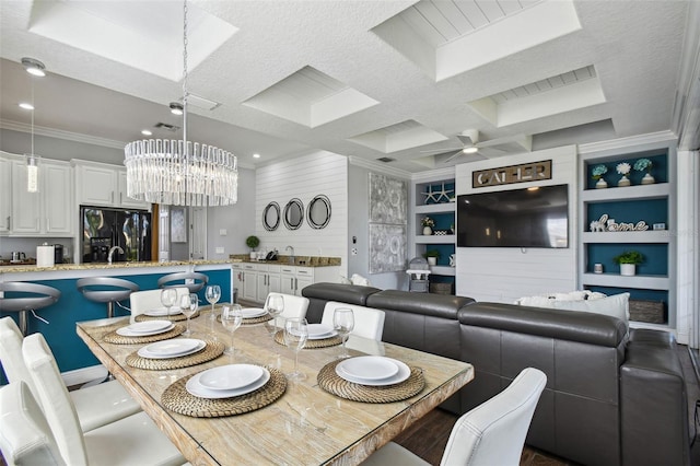 7523 Excitement Dr, Kissimmee, FL 34747 - dining space featuring ornamental molding, a chandelier, built in features, a ceiling fan, and beam ceiling