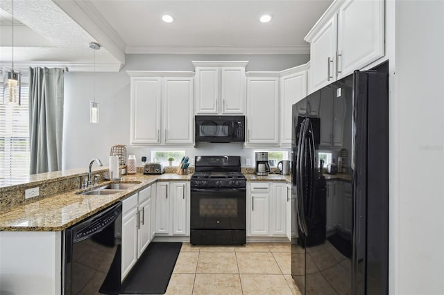 7523 Excitement Dr, Kissimmee, FL 34747 - kitchen featuring black appliances, a sink, a peninsula, white cabinets, and crown molding