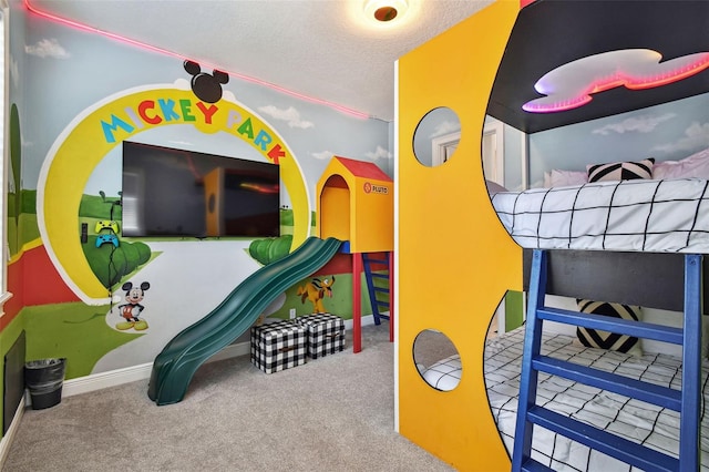 7523 Excitement Dr, Kissimmee, FL 34747 - recreation room featuring carpet flooring, baseboards, and a textured ceiling