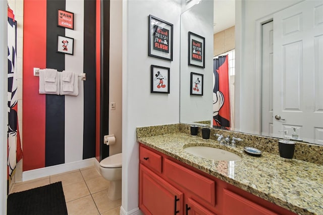 7523 Excitement Dr, Kissimmee, FL 34747 - bathroom with toilet, vanity, tile patterned floors, baseboards, and curtained shower