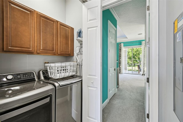 7523 Excitement Dr, Kissimmee, FL 34747 - laundry room with cabinet space, washing machine and dryer, and light carpet