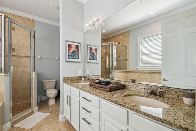 7523 Excitement Dr, Kissimmee, FL 34747 - full bath with double vanity, a stall shower, tile patterned floors, toilet, and ornamental molding
