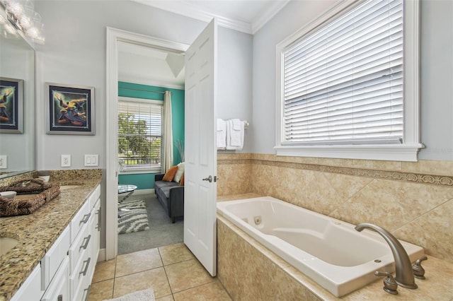 7523 Excitement Dr, Kissimmee, FL 34747 - bathroom featuring a tub with jets, ornamental molding, double vanity, tile patterned flooring, and ensuite bath