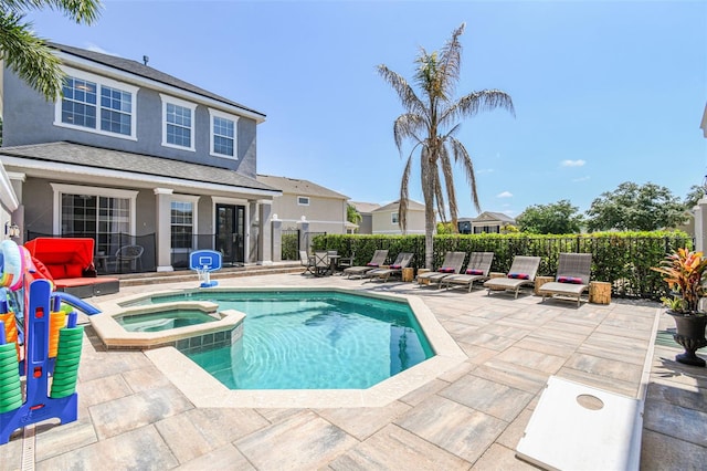 7523 Excitement Dr, Kissimmee, FL 34747 - view of swimming pool featuring a patio area and a pool with connected hot tub