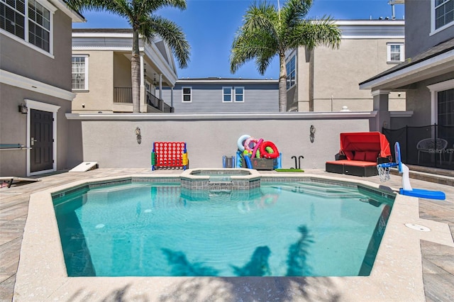 7523 Excitement Dr, Kissimmee, FL 34747 - view of swimming pool featuring a pool with connected hot tub and a patio