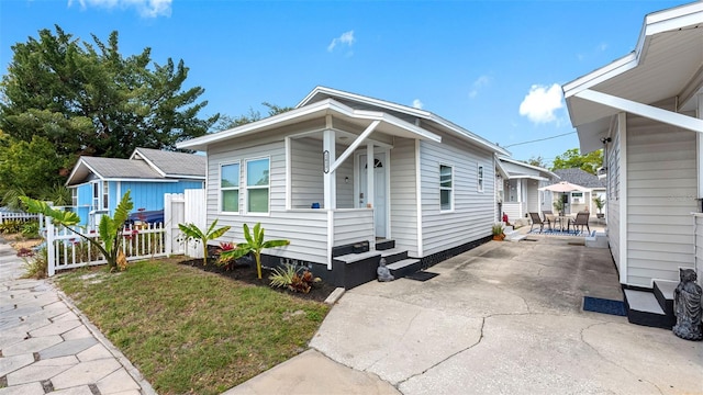 1615 28th Ave N, Saint Petersburg, FL 33713 - view of front of home with a patio and outdoor dining area
