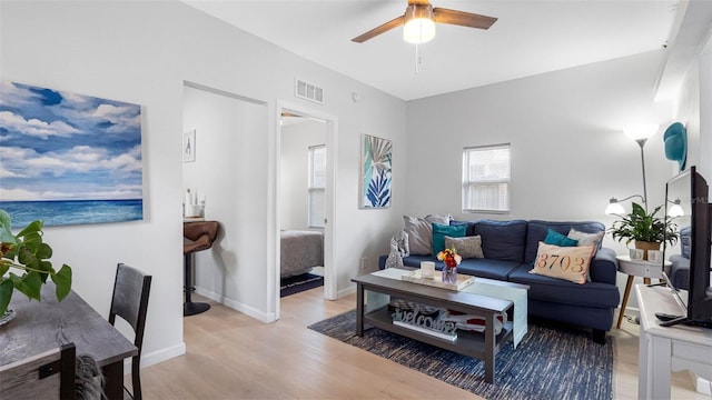 1615 28th Ave N, Saint Petersburg, FL 33713 - living area with a ceiling fan and light wood-style floors