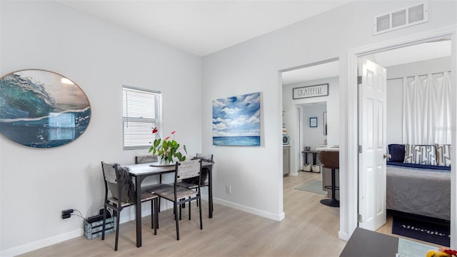 1615 28th Ave N, Saint Petersburg, FL 33713 - dining room with light wood-style flooring and baseboards