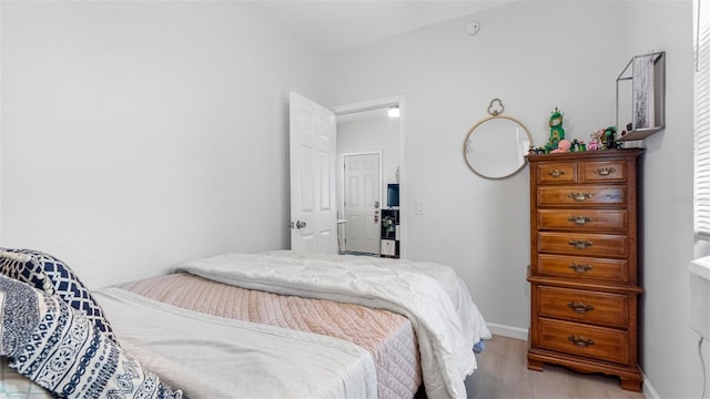1615 28th Ave N, Saint Petersburg, FL 33713 - bedroom with light wood-type flooring and baseboards
