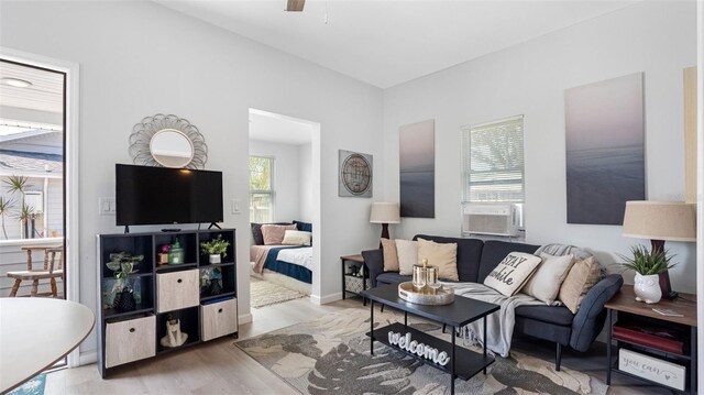 1615 28th Ave N, Saint Petersburg, FL 33713 - living area with wood finished floors, cooling unit, and a ceiling fan