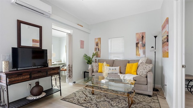 1615 28th Ave N, Saint Petersburg, FL 33713 - living room featuring an AC wall unit and light wood-style floors
