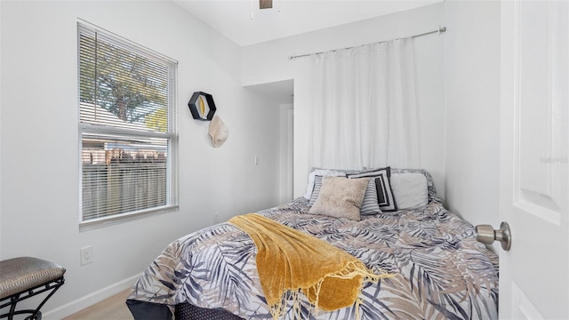 1615 28th Ave N, Saint Petersburg, FL 33713 - bedroom with baseboards, wood finished floors, and a ceiling fan