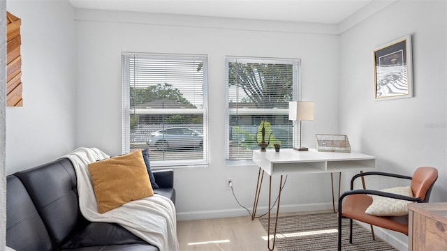 1615 28th Ave N, Saint Petersburg, FL 33713 - living area with wood finished floors, baseboards, and a desk