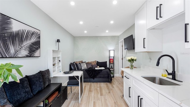 1615 28th Ave N, Saint Petersburg, FL 33713 - kitchen with an accent wall, a sink, wallpapered walls, recessed lighting, and open floor plan