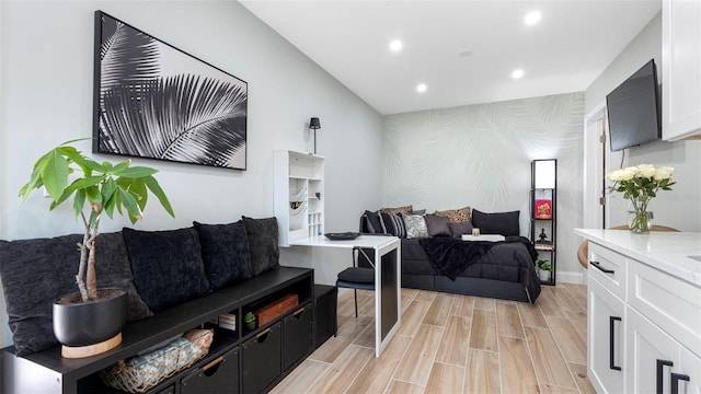 1615 28th Ave N, Saint Petersburg, FL 33713 - living area featuring an accent wall, wallpapered walls, recessed lighting, baseboards, and light wood-style flooring