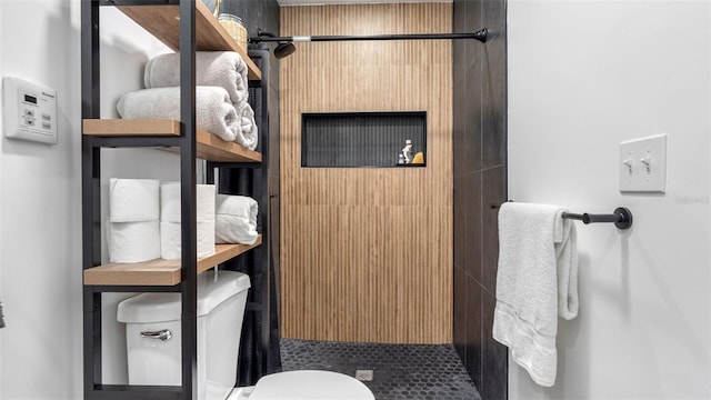 1615 28th Ave N, Saint Petersburg, FL 33713 - bathroom featuring a shower stall, toilet, and tile patterned flooring