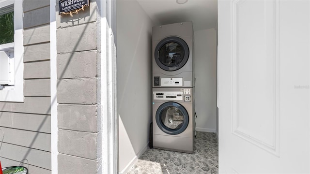 1615 28th Ave N, Saint Petersburg, FL 33713 - laundry room with stacked washer / dryer and baseboards